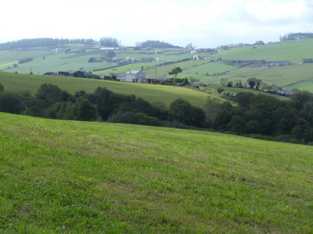 Some of that rolling countryside in the distance, with such a green pasture up front
